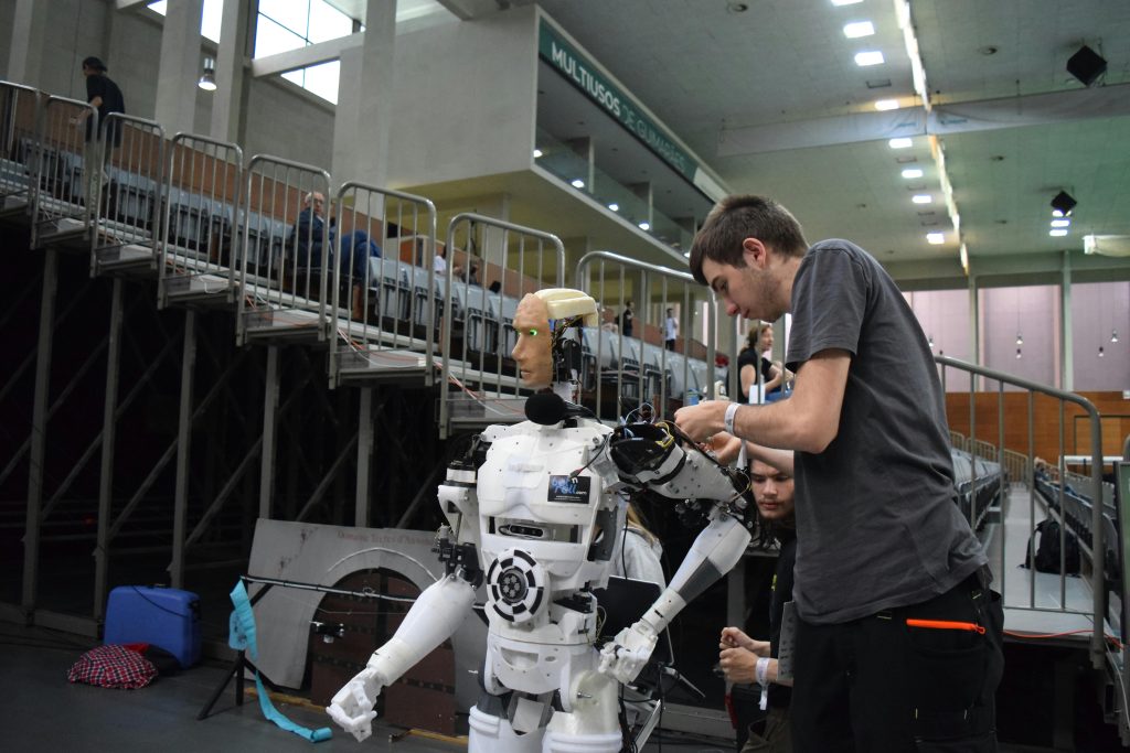 pexels photo 12499181 12499181 Technician working on humanoid robot at a tech exhibition in Guimaraes, Portugal.